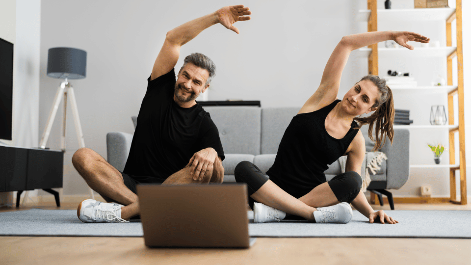 Online Fitness Class Couple Stretch Couple Stretching During the Online fitness Classes